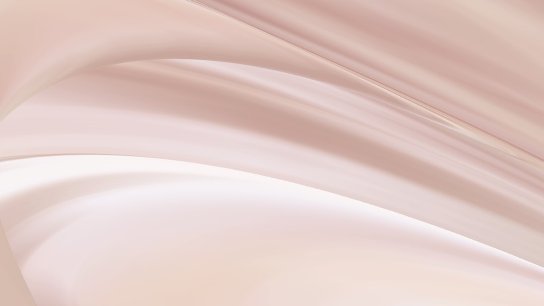 Abstract soft blush texture representing the clinic's elegant approach